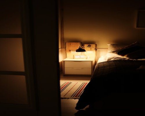 Cozy bedroom with soft lighting for a good rest