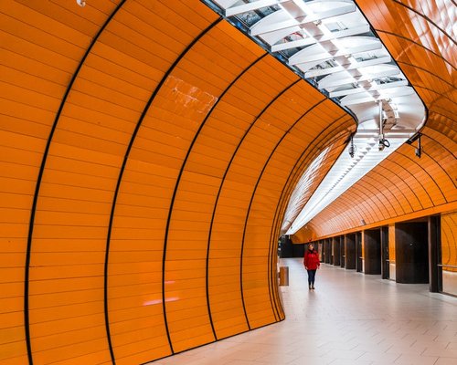 Commuter walking through a modern transit station